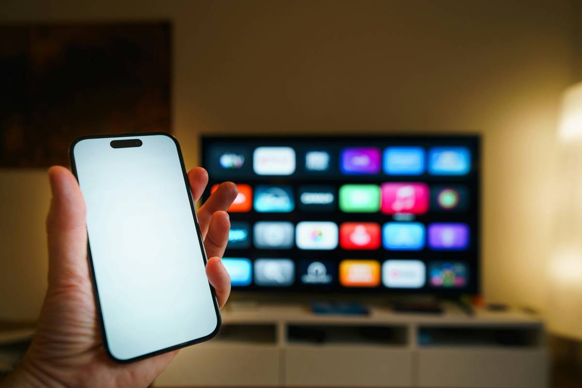 A modern living room showcasing intelligent home automation benefits with seamless lighting, climate, and security integration
