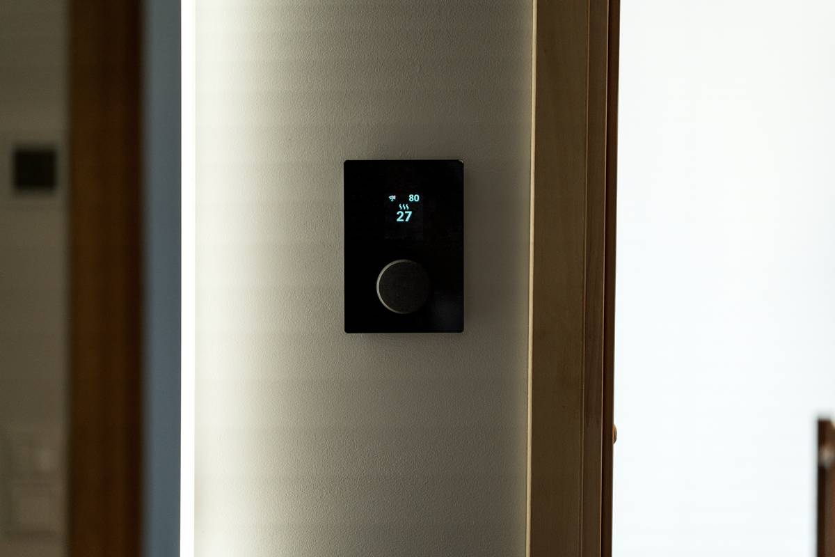 Smart home automation Sonoff switch installed in wall socket controlling lights